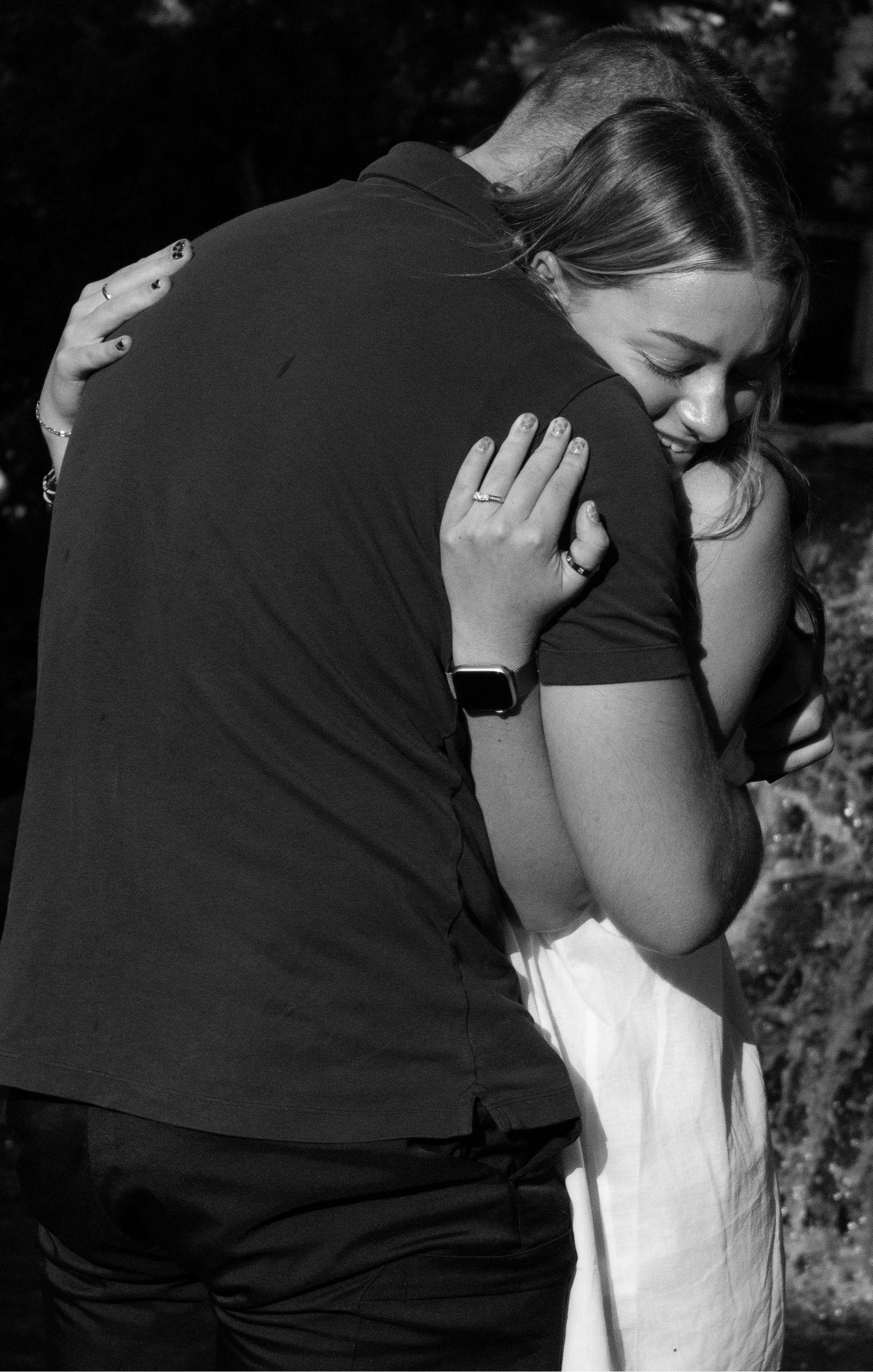 Alex & Morgan hug b&w